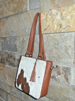 Natural cowhide bags are durable and strong with canvas lining and are handcrafted by experienced people.