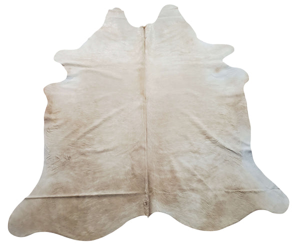 This cream beige cowhide rug makes a strong statement in any space, its lighter shade is perfect for any room and blends together with all the decor.