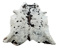 A stunning salt pepper pattern cowhide rug for your entry way or home office, each cowhide is selected for exotic markings, perfect for upholstery.