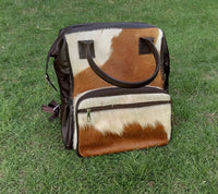 Handmade from real western cowhide this is our new addition to mommy diaper bags my from real calf cow hide.