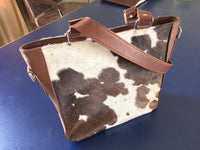 You can select the cowhide you like and we will give it a perfect touch of cowhide purses