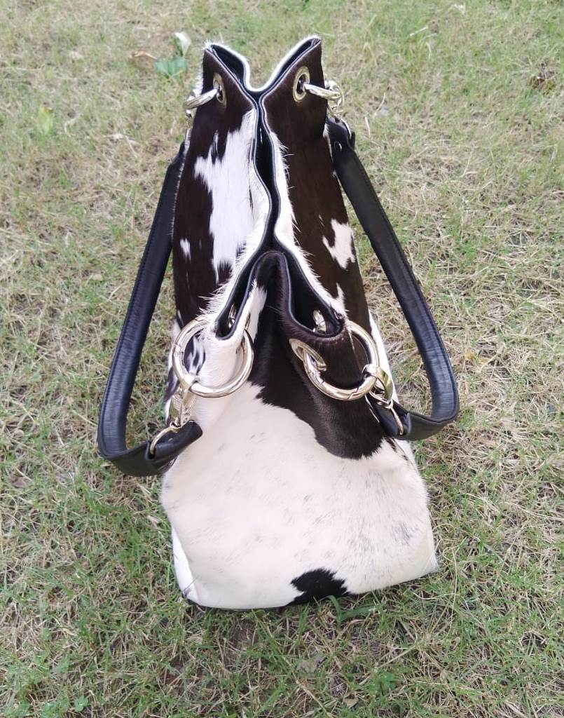 If you're looking to get on board with this trend, there are a few things you should keep in mind. First, make sure to choose a cowhide bag that's the right size for you.