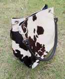 These handbags are made from cowhide, which is a popular material choice because it is durable and soft. Cowhide Shoulder bags come in many different styles, including hobo and messenger bags.