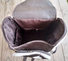Cowhide leather backpack featuring natural speckled hair-on hide