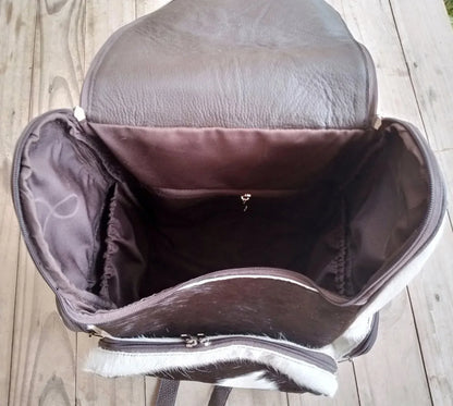 Cowhide leather backpack featuring natural speckled hair-on hide