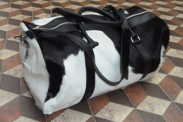 New pony fur duffel bag is made in brown white great for overnight weekender stay, it has large pockets inside and outside, custom made from real fur leather.