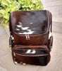 Speckled cowhide backpack featuring dark brown white natural hide