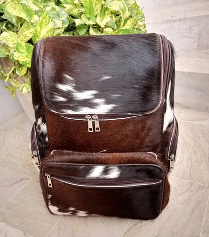 Speckled cowhide backpack featuring dark brown white natural hide