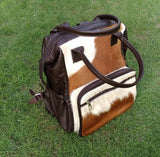 Truly impeccable real hair on cowhide purse, not something you will find in a store; totally one of a kind travel bag for you add a cowhide wallet to match