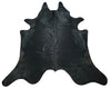 Elevate your home decor with a genuine black cowhide rug, known for its rich color and unique patterns that bring a bold statement to any room.