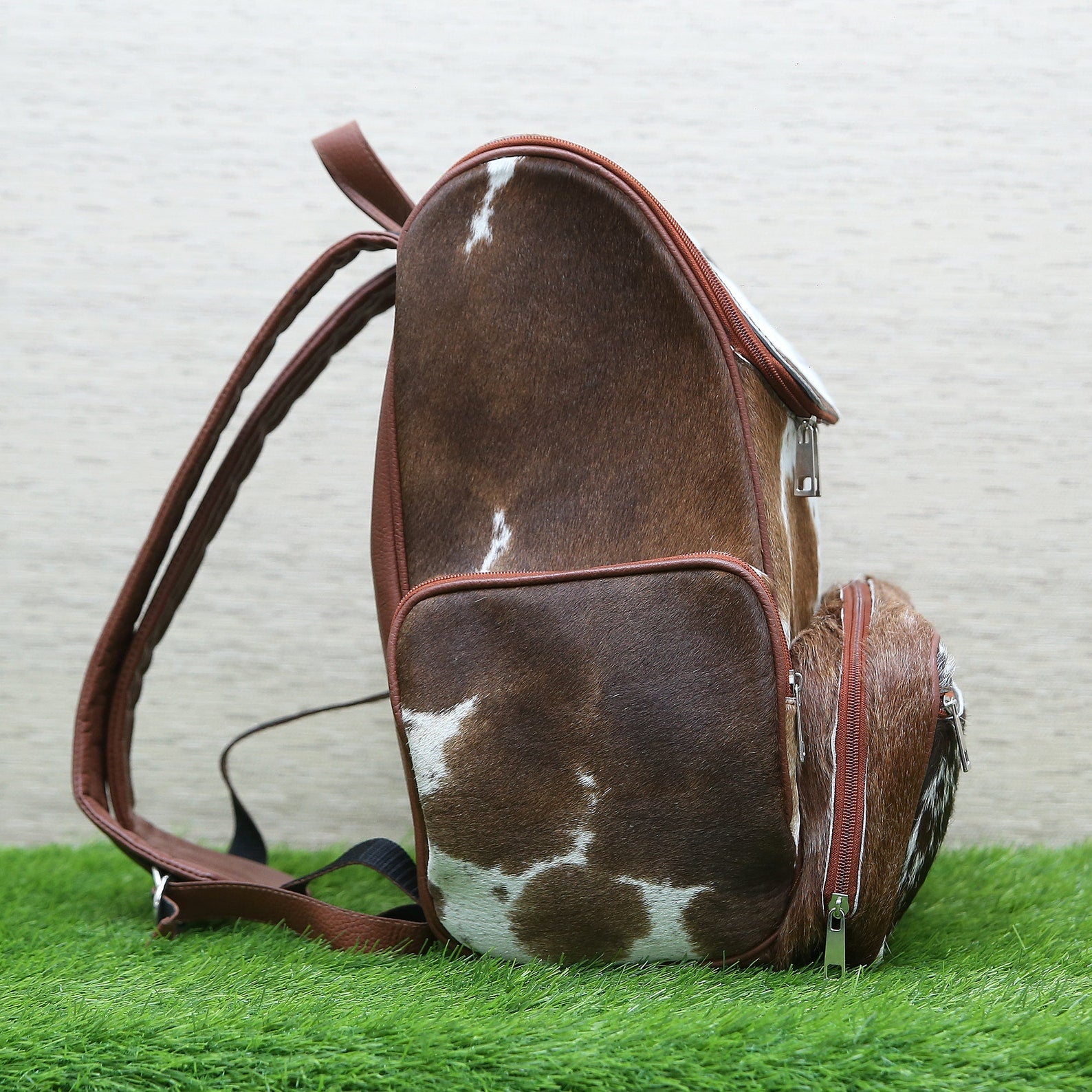 When it comes to finding the perfect backpack, if you're looking for a stylish, custom-made backpack that will turn heads, then you need a real cowhide.  