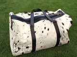 Choose convenience with our cowhide overnight bag, a spacious solution for your travel essentials.