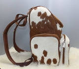 Are you a fan of rodeo check out our cowhide mommy backpack in spotted pattern, this bag for sale is one you need as shopper bag. 
