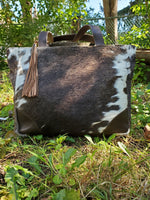 a unique ranch cowhide purse in crossbody messenger bag