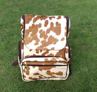 A new product called cowhide mummy backpack is perfect for new mommies with little kids. It is made from real cowhide and has a brown and white pattern. Mommy Back can be customized to fit the needs of each individual mommy.