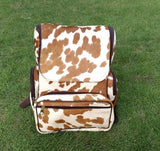 A new product called cowhide mummy backpack is perfect for new mommies with little kids. It is made from real cowhide and has a brown and white pattern. Mommy Back can be customized to fit the needs of each individual mommy.