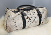 A large cowhide travel tote bag is great for work, school, leisure, shopping, travel this spotted cow fur leather bag can easily hold all your travel gear