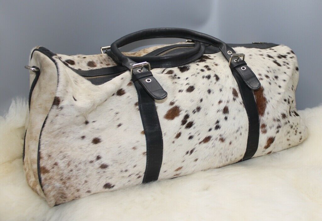 A large cowhide travel tote bag is great for work, school, leisure, shopping, travel this spotted cow fur leather bag can easily hold all your travel gear