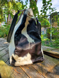 Our latest bag come with flap made from cowhide. 