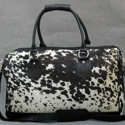 Cowhide duffle bag black white travel leather