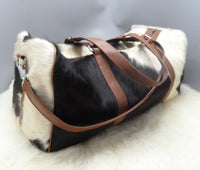 You will love the bag, It's beautiful for a full time student and part time nanny, cowhide bag works for all your needs.
