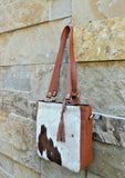 Each cowhide bag is made from real cow skin and shade varies from purses to purses. 