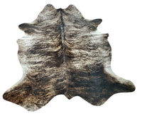 Brindle cowhide rug unique coloring and delicate patterning make it a standout piece, while its small size ensures it will work in any space.