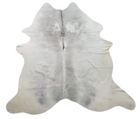 A grey cowhide rug exactly as shown in the picture, oft and natural pattern perfect for southern style farmhouse, Inexpensive free shipping USA.
