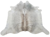 A beautiful natural cowhide rug, light grey enough to blend with your deck furniture, very soft and smooth, perfect for upholstery and area rugs.