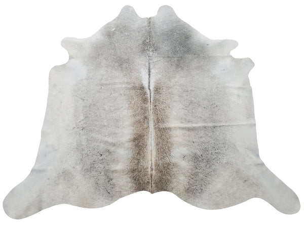 A beautiful natural cowhide rug, light grey enough to blend with your deck furniture, very soft and smooth, perfect for upholstery and area rugs.