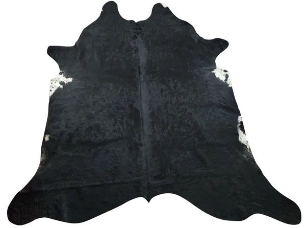 Beautiful large black cowhide rug will never go out of style, it will be an investment of the lifetime, natural and solid warm shade is perfect for any room