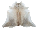 This cowhide rug have a lovely array of various shades of grey and light tan, and it is very dense and tender, it is hundred percent natural and works wonder for upholstery purposes. 