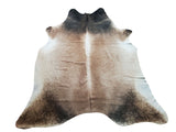 We just adore this cowhide rug with a mixed design on both dark and light colors. It reminds us of a calm provincial ambience without any need for any scenery.