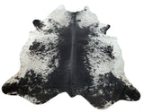 A stunning and trending cowhide rug for contemporary, trendy or farmhouse in large classic black and white with back finish to suede.