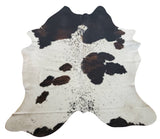 A brown and white cowhide can look stunning over top of area rugs, we are the best place to buy real hides with over hundreds of natural patterns 