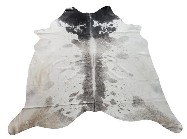 A large grey white cowhide rug is a great decoration for any house, it gives a calm and cozy feeling in any space, it's hundred percent natural and real.