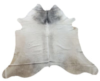 The grey cowhide rug can also help to ground the furniture and make the room feel more inviting, it is free shipping all over the USA, natural and hundred percent real.