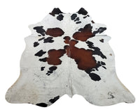 If you wish to have something which is not too crowded, this tricolor spotted cowhide rug is a great choice, it compliments colorful artwork or is layered with another rug.