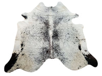 A trendy speckled cowhide rug in black and white colors to match nearly any living room or kitchen, it is an excellent addition to any house. It's of good quality and looks great.