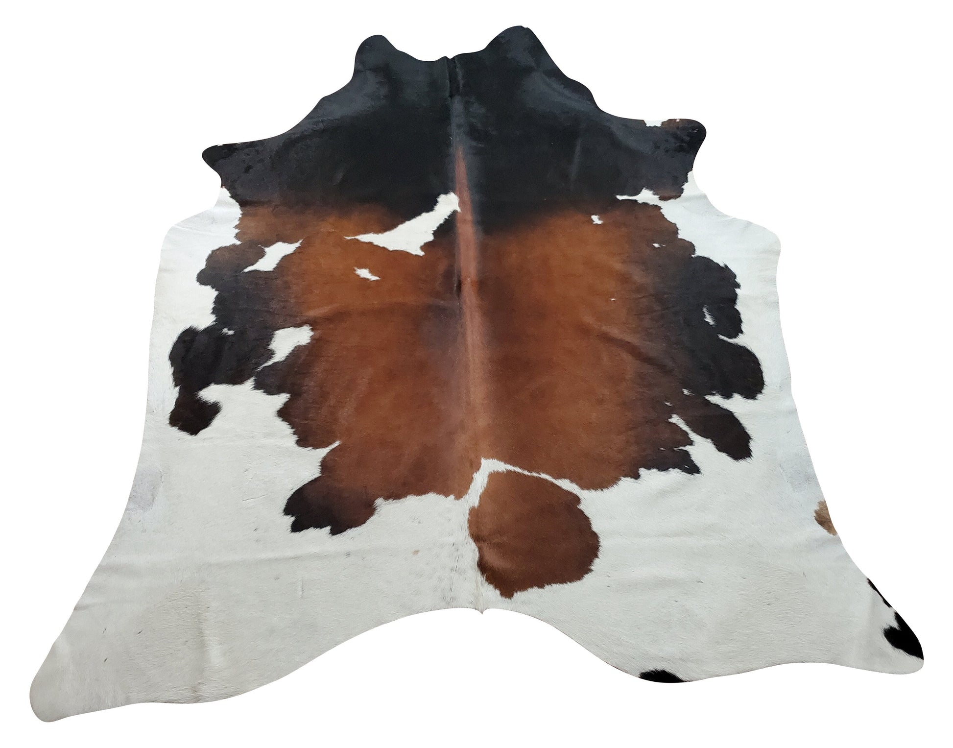 A tricolor cowhide rug is the ideal item to glue a room together weather its a rustic style cottage or modern living room, we have hundreds of natural shades and patterns. 