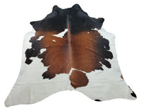A tricolor cowhide rug is the ideal item to glue a room together weather its a rustic style cottage or modern living room, we have hundreds of natural shades and patterns. 