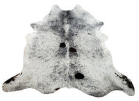 This speckled pattern cowhide rug with black white couch will take your living room to a level, soft, real and authentic hide rugs are gorgeous