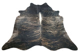 A large dark grey cowhide rug for the living room very soft to touch and walk on it, hundred percent natural and real.