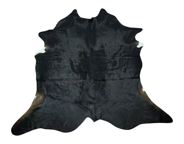 A small black cowhide rug that looks really pretty and cute, works just fine for any space or home office decor.