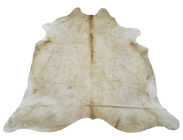 A light beige cowhide rug is great for hardwood floors and keeps the room warm and creates a cool cozy effortless vibe. 
