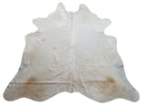The sumptuous butter cream cowhide rug is inspiring for a cozy living room. It is great for high traffic areas.