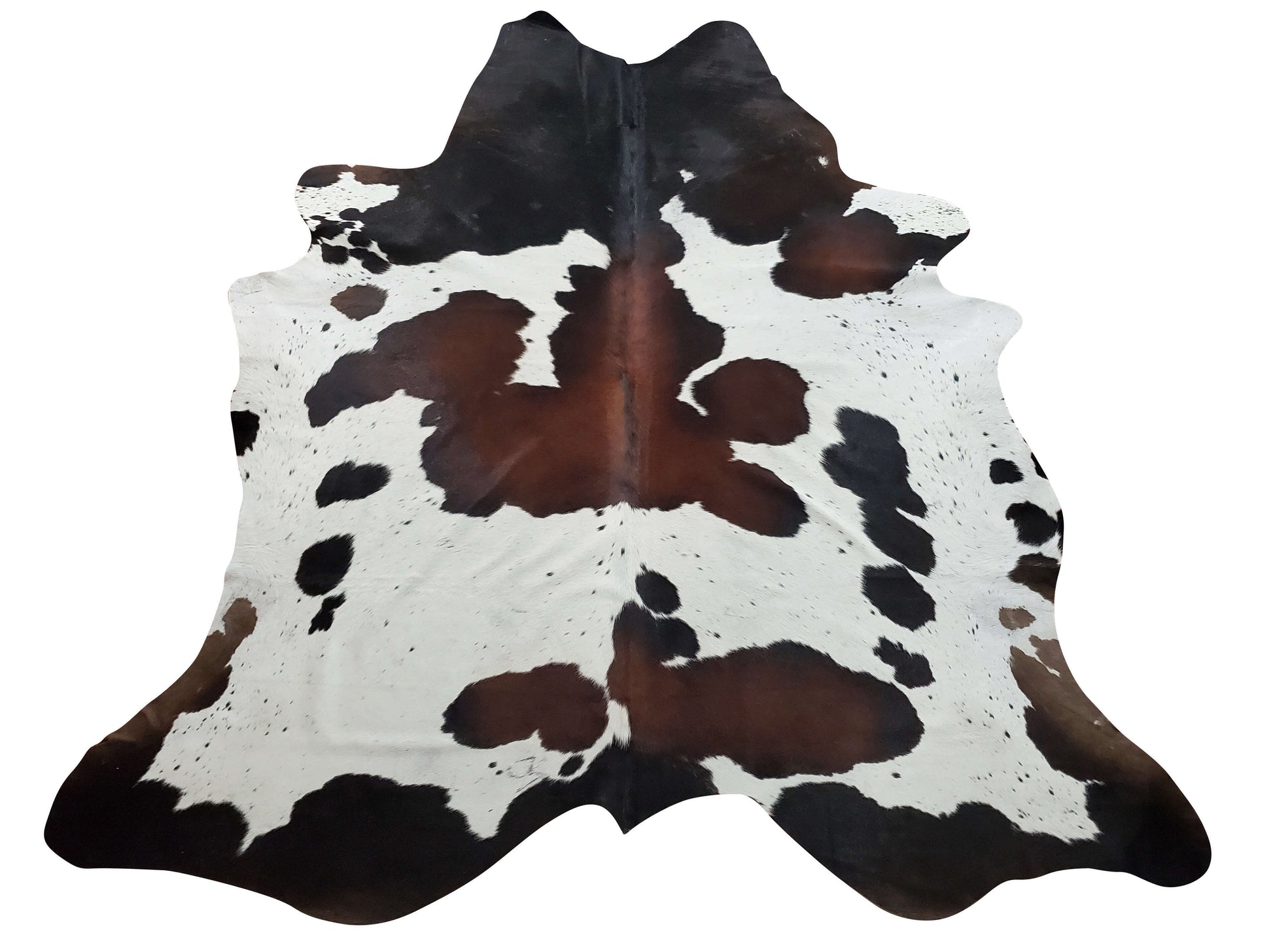 Tricolor cowhide area rug for modern boho living room, free shipping, soft, smooth and natural. These cow hide rugs are great for upholstery, draperies.