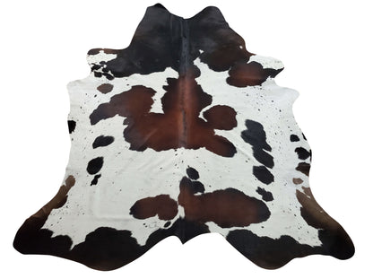 Tricolor cowhide area rug for modern boho living room, free shipping, soft, smooth and natural. These cow hide rugs are great for upholstery, draperies.