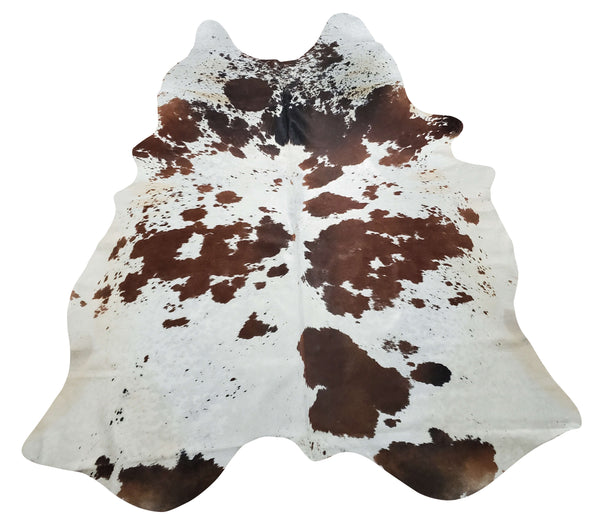 A tricolor cowhide rug will add a western element to your living room, it will be the focal point of the space, a great size and soft to the touch.