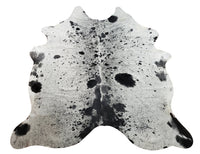 This one is special black and white cowhide rug, very silky and comfy, and 100% genuine. The salt and pepper pattern looks great in a variety of rooms or spaces.